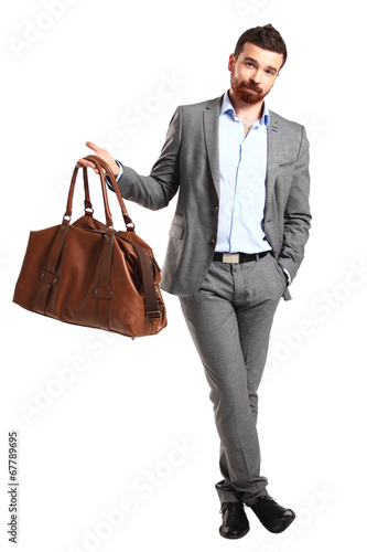 Photo: Business man with briefcase standing on white background Business man with briefcase standing on white background