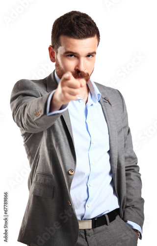 Photo: young business man pointing to the camera on white background young business man pointing to the camera on white background