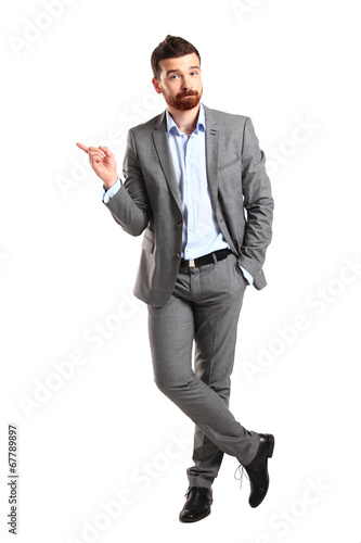 Photo: Happy business man presenting with copy space for your text Happy business man presenting with copy space for your text