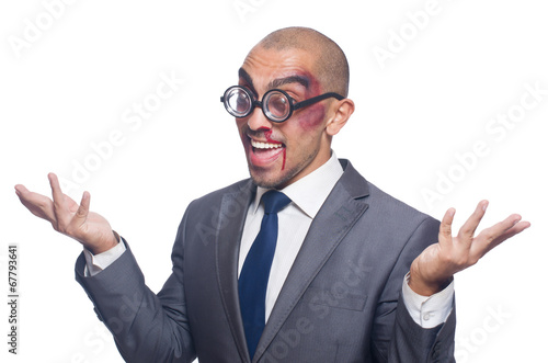 Photo: Badly beaten businessman isolated on white Badly beaten businessman isolated on white