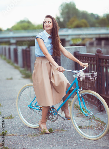 Photo: Young beautiful, elegantly dressed woman, summer and lifestyle Young beautiful, elegantly dressed woman, summer and lifestyle