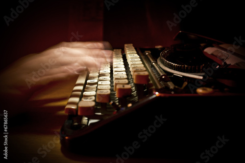 Photo: Typing On A Vintage Typewriter Typing On A Vintage Typewriter