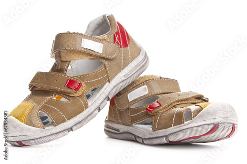 Photo: Brown shoes for kids isolated over a white background Brown shoes for kids isolated over a white background