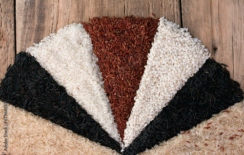 Photo: different types of rice on the old wooden table different types of rice on the old wooden table