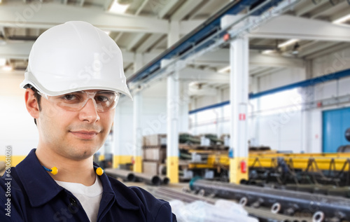 Photo: Portrait of a worker in a factory Portrait of a worker in a factory