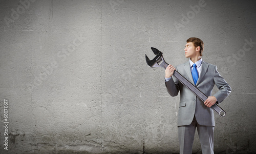 Photo: Businessman with wrench Businessman with wrench
