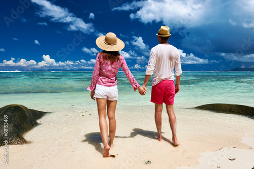 Photo: Couple on a beach at Seychelles Couple on a beach at Seychelles