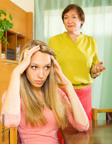 Photo: adult daughter and senior mother after quarrel adult daughter and senior mother after quarrel