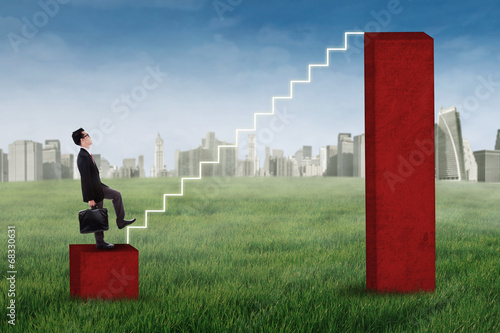 Photo: Businessman stepping up on the stairs 1 Businessman stepping up on the stairs 1