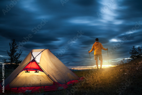 Photo: Man on camping at sunrise Man on camping at sunrise