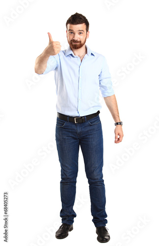 Photo: Happy man with thumbs up gesture, isolated on white Happy man with thumbs up gesture, isolated on white