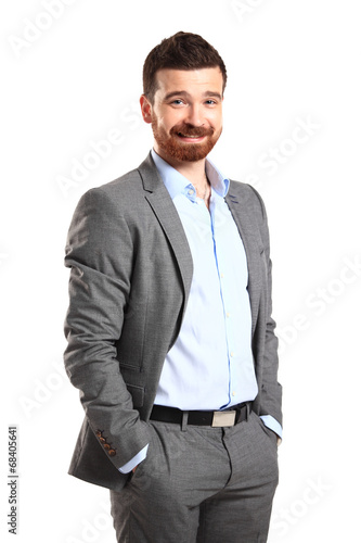 Photo: Handsome casual man smiling - isolated over a white background Handsome casual man smiling - isolated over a white background