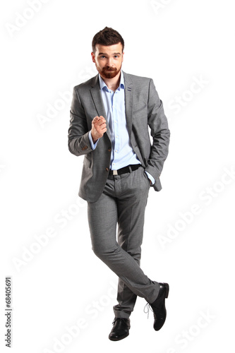 Photo: young business man pointing to the camera on white background young business man pointing to the camera on white background