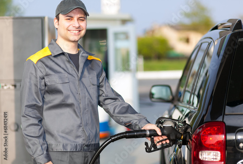 Photo: Man working at the gas station Man working at the gas station