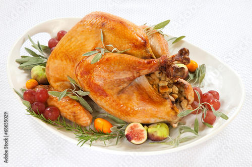 Photo: Roasted Turkey on tray over white Roasted Turkey on tray over white