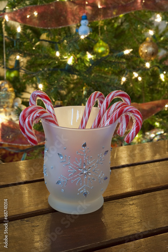 Photo: Jar of Candy Canes with Christmas Tree Jar of Candy Canes with Christmas Tree