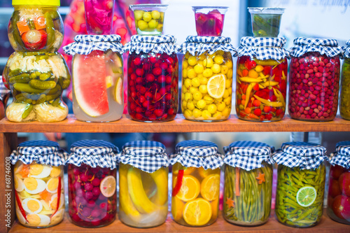Photo: Mediterranean pickled vegetables and fruits on the open market Mediterranean pickled vegetables and fruits on the open market
