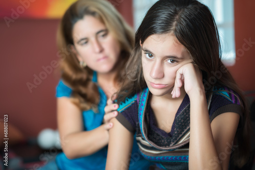Photo: Mother comforts her sad teenage daughter Mother comforts her sad teenage daughter