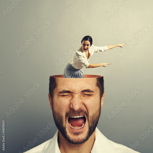 Photo: stressed man with screaming woman stressed man with screaming woman
