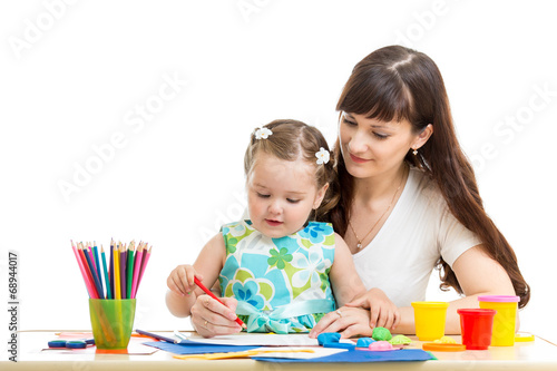 Photo: mother and her child girl pencil together mother and her child girl pencil together