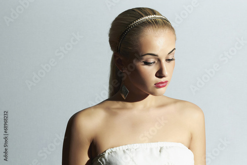 Photo: sad bride in white dress.Beautiful blond woman.stylish girl sad bride in white dress.Beautiful blond woman.stylish girl