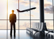 businessman standing in airport businessman standing in airport