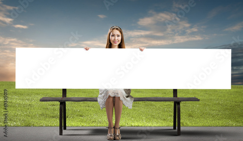 Photo: Girl with banner Girl with banner