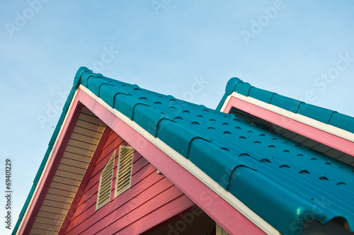 Photo: Roof of a new wooden house with a blue sky Roof of a new wooden house with a blue sky