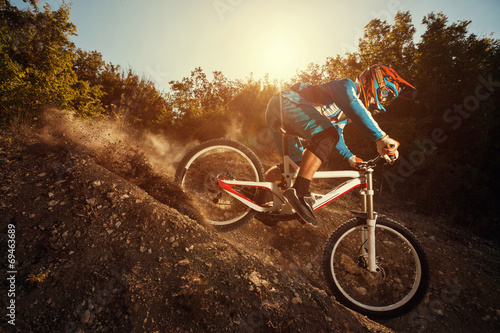  Downhill mountain bike. Man cyclist riding bicycle