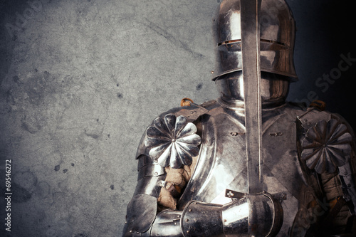 knight wearing armor and holding two-handed sword