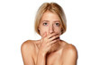 stunned and shameful young blonde on white background