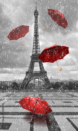 Fototapeta Eiffel tower with flying umbrellas.