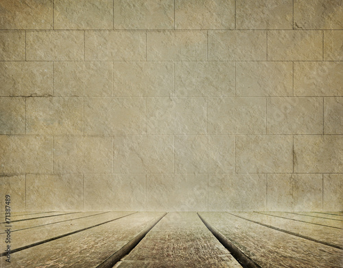 Old brick wall and wooden floor background