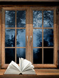 Open book on windowsill Open book on windowsill