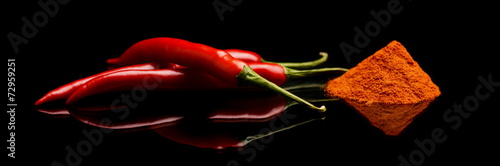 Studio shot chilli pepper, cayenne pepper isolated on black