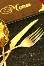 Christmas golden cutlery and restaurant menu 