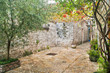 narrow stone street with plants narrow stone street with plants