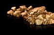 Gold nuggets on black background. Gold nuggets on black background.