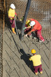 Construction workers casting foundations of hydro power plant Construction workers casting foundations of hydro power plant