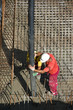 Construction workers casting foundations of hydro power plant Construction workers casting foundations of hydro power plant