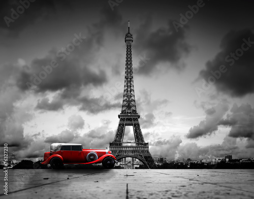 Fototapeta Effel Tower, Paris, France and retro red car. Black and white