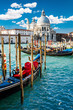 Grand Canal in Venice, Italy, with colorful gondola boats Grand Canal in Venice, Italy, with colorful gondola boats