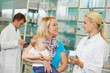 Pharmacy chemist, mother and child in drugstore Pharmacy chemist, mother and child in drugstore