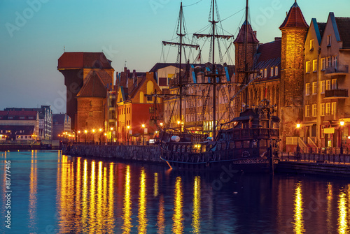 Fototapeta The riverside with the characteristic Crane of Gdansk, Poland.