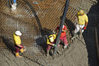 Construction workers casting foundations of hydro power plant Construction workers casting foundations of hydro power plant