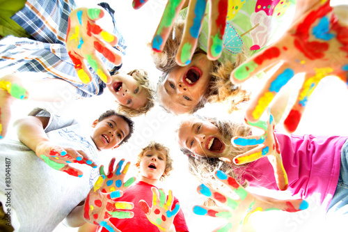 smiling kids with colourfull hands