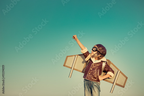 Happy child playing with toy airplane