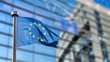 European Union flag against European Parliament European Union flag against European Parliament