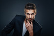 Portrait of handsome man in a studio on a dark background Portrait of handsome man in a studio on a dark background