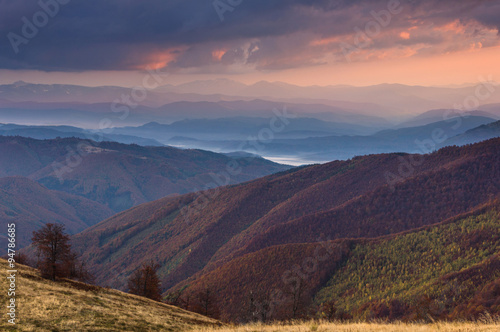 Colorful sunset  in the autumn mountains.
